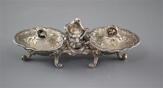 An 18th century French rococco white metal double salt, with hinged covers, on scrolling feet, marks quite rubbed, 18.3cm, 12.5oz,